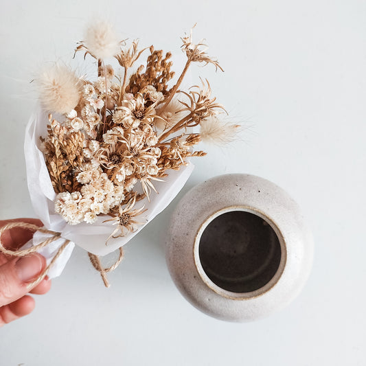 Dried flower posy in natural tones with complementing bud vase.