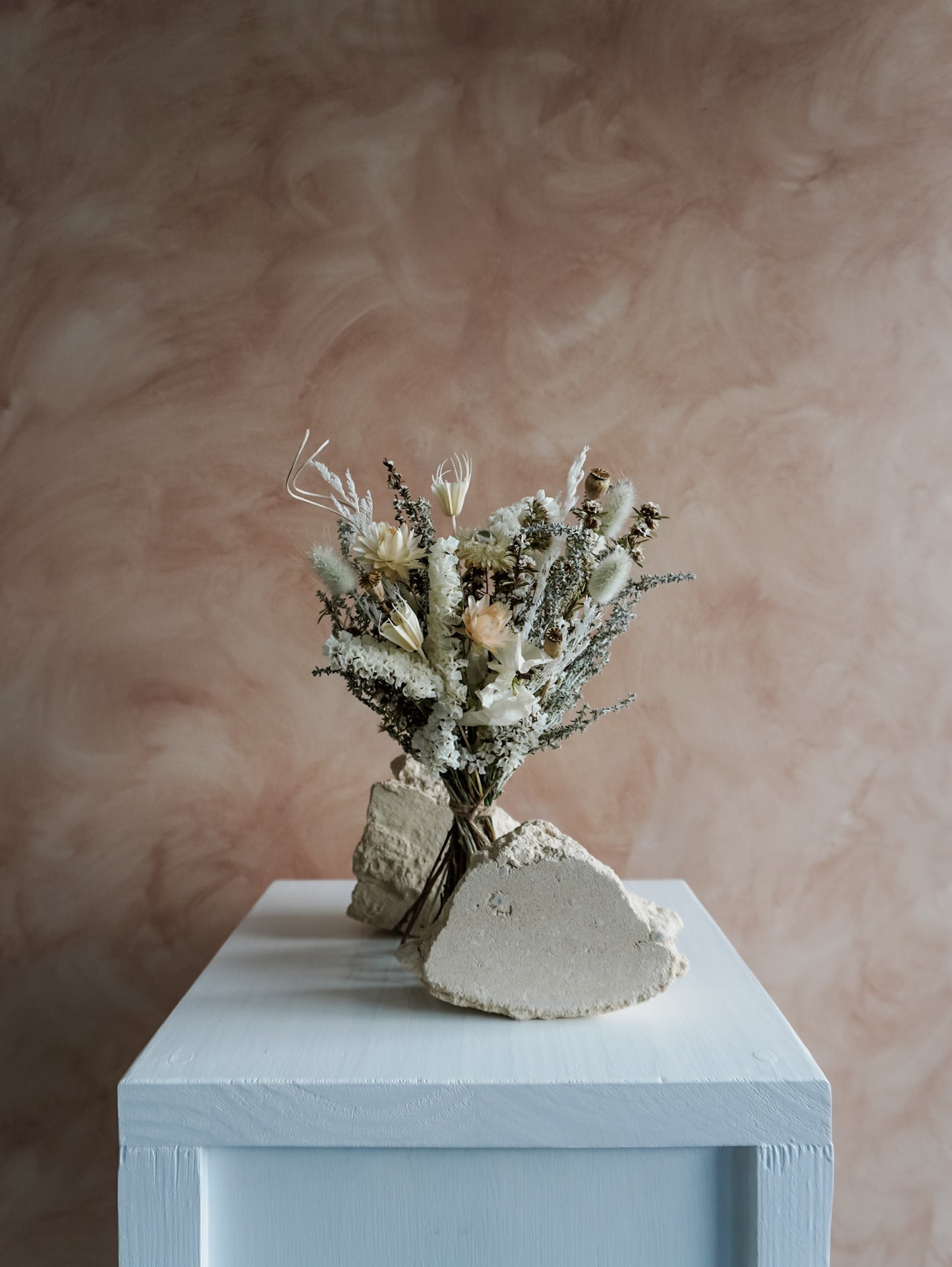 Dried flower bouquet in classic neutral white tones with boho styling – Posy Size Distant View.