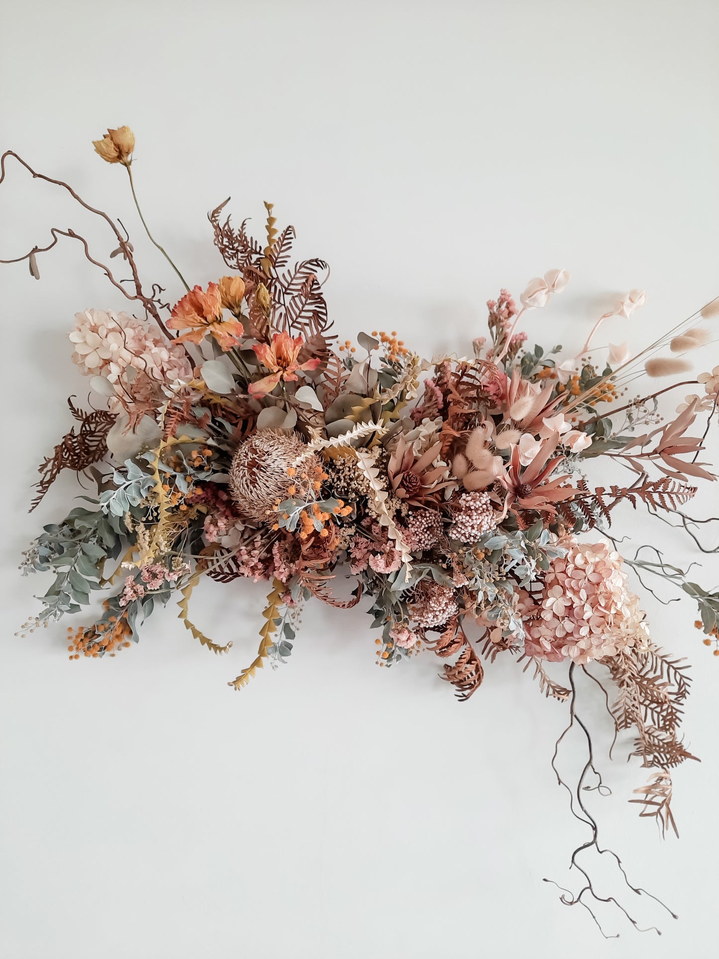Dried flower wall hanging in pastel tones – close full view.