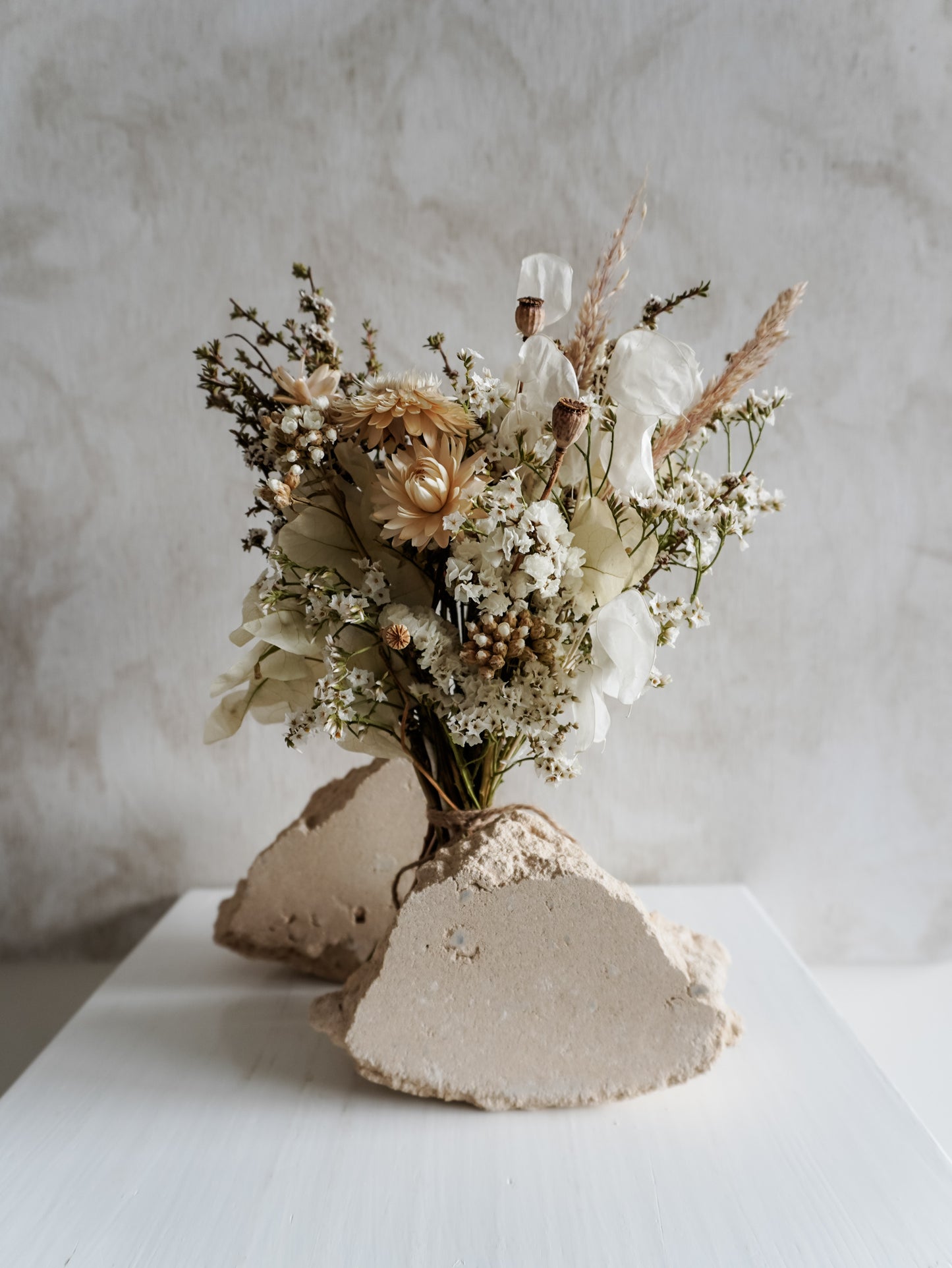 Dried flower bouquet in classic neutral white tones with boho styling – Posy Size Distant View.