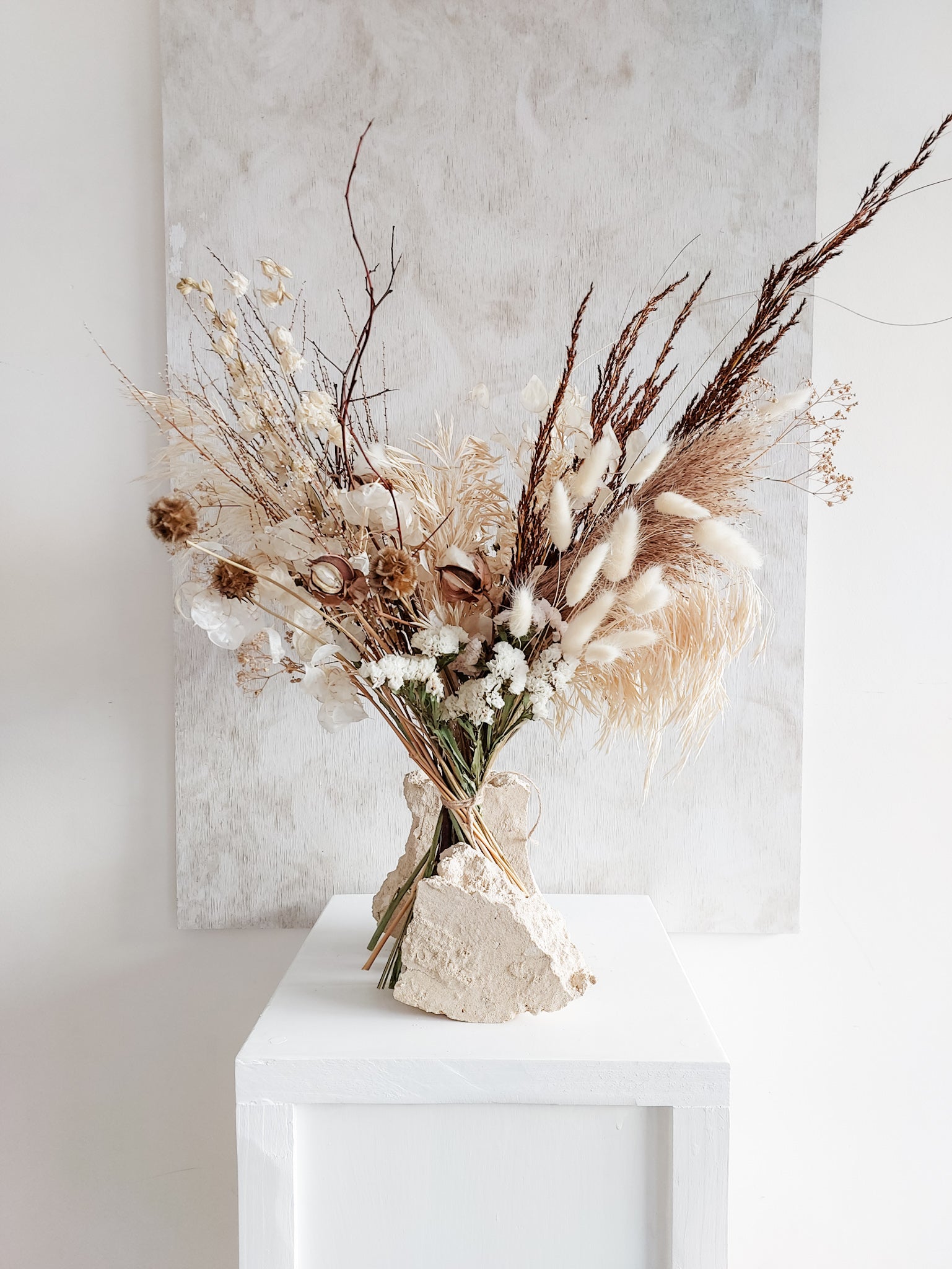 Dried flower bouquet in classic neutral white tones with boho styling – Luxe Size Distant View.