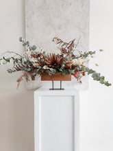 Load image into Gallery viewer, Dried flower centrepiece in rustic vase featuring natural textural florals – back view 2.
