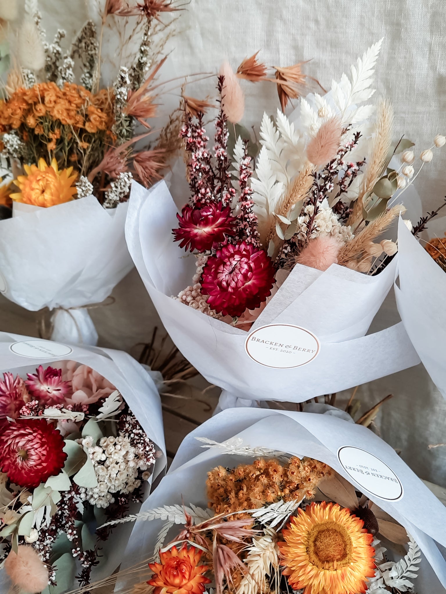 Dried flower posies in bright pink and yellow - bridesmaid proposal gift.