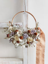 Load image into Gallery viewer, Dried flower wreath in lilac tones on a rattan hoop base – close full view.
